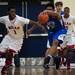 Milan player CJ Turnage tries to steal the ball and fouls a Gibraltar Carlson player on Monday, March 11. Daniel Brenner I AnnArbor.com